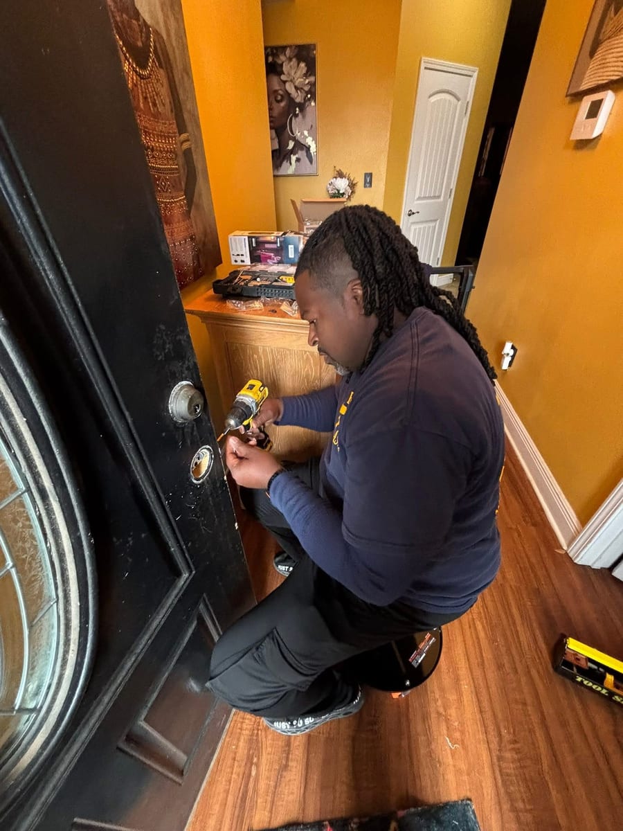 Reuben installing door hardware